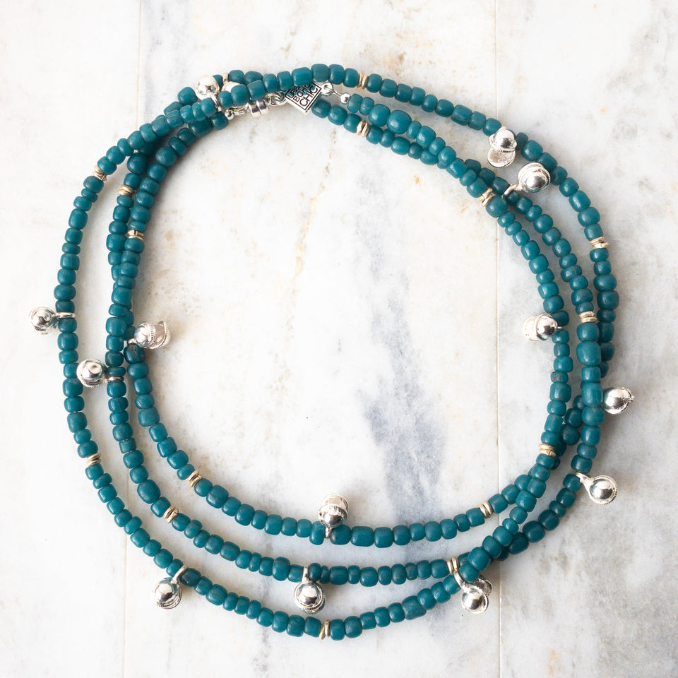 Teal blue Javanese glass beads mingle with gold or silver brass India Dancing Bells.  Named for Shiva Nataraja, or Lord of the Dance. Wraps may be worn as a necklace, choker, bracelet or anklet. US made magnetic clasp for easy styling