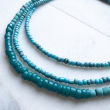 Load image into Gallery viewer, Blue Bliss Wrap brings together 3 types of handmade blue beads: Teal Blue Javanese Glass, Cadet Blue African Gooseberry beads, and Denim Blue African Goomba beads
